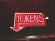 © Jess Lewis/Stocksy - neon token sign