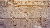 Fototapeta  - Egypt Hieroglyphic god face got destroyed at Edfu Horus temple feature wall