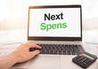 © Sinfebeth - laptop with words Next spens Procedures on white screen, business and finance concept.