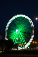 Moving Ferris Wheel Near Vistula River In Cracow At Night, Poland