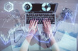 © peshkova - Double exposure of woman hands working on computer and forex graph hologram drawing. Top View. Financial analysis concept.