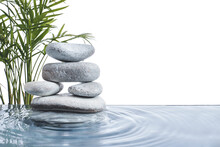Stack Of Spa Stones And Tropical Branches In Water On White Background
