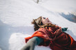 © Michela Ravasio/Stocksy - Young woman making snow angel