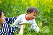 © Bo Bo/Stocksy - happy little girl playing with her mother outdoor in spring field