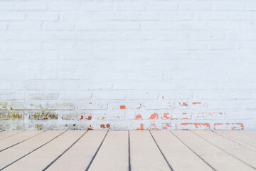 Wall Mural - The vintage interior features cracked white old brick walls and light yellow wood floors. Room interior vintage with white brick wall and wood floor background.