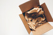 © Kelly Knox/Stocksy - empty packing box with copy space