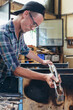 © VISUALSPECTRUM/Stocksy - Artisan Glass Workshop - Male Hipster Artist Shaping Hot Glass With Pliers