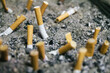 © AlejandroMCB photo & film/Stocksy - Cigarettes on ashtray