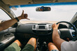 © AlejandroMCB photo & film/Stocksy - Two young friends pov view on the inside of a car on a road trip traveling through the desert. Namibia