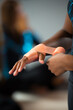 © B Scott Photography/Stocksy - African American Gymnast Wraps Her Hands for Bar Routine