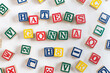© Amanda Large/Stocksy - 'Haters gonna H8' written in children's alphabet blocks