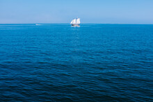 A Sail Boat In The Blue Ocean