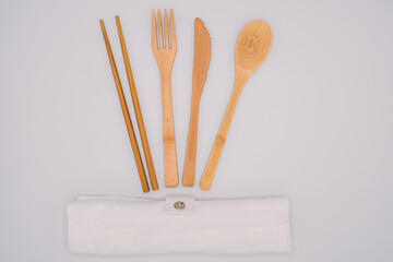 Eco friendly bamboo cutlery set isolated background. Zero waste concept. wooden travel cutlery set, copyspace, flatlay 