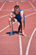 © sata_production - Adaptive athlete with prosthetic foot at the start of running track