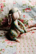 Stuffed Bunny Toy On A Floral Background