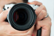 © JayC75 - Man taking a photo holding a camera