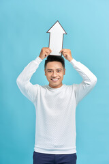 Wall Mural - Smiling man holding white sign of arrow