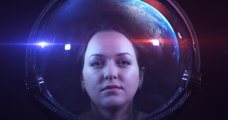 Wall Mural - portrait shot of the young smiling female astronaut in space helmet. she is exploring outer space in