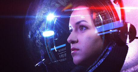 Wall Mural - young beautiful female astronaut in space helmet looking at camera. she is exploring outer space in 