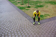 © minamoto images/Stocksy - Exhausted runner having a break standing on a crossroad