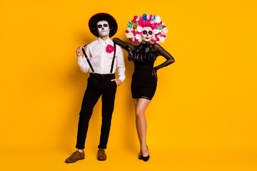 Full length body size view of his he her she nice-looking glamorous elegant chic confident cool trendy couple posing calavera event isolated bright vivid shine vibrant yellow color background