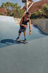 Wall Mural - Skateboarding. Man In Urban Outfit Riding On Skateboard On Concrete Ramp At Skatepark. City Sport As Hobby For Active Guys. Skater Subculture And Summer Activity As Lifestyle.