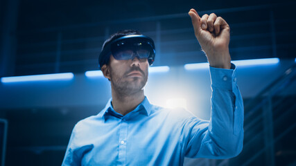 Aufkleber - In 3D Content Creating Laboratory Engineer Wearing Professional Virtual Reality Headset Works and Gestures in Augmented Reality. Stylish Low Angle Portrait Shot 