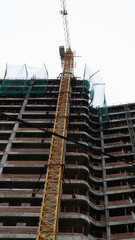 construction of a building and cloudy sky