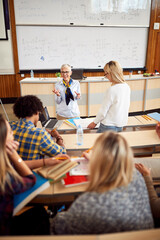 Wall Mural - Professor giving lecture to her students