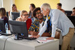 © luckybusiness - Female professor with pupils looking in computer