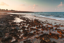 Red Rocky Coast Of Cyprus Island At Sunrise