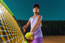 Tennis Player. Beautiful Girl Teenager And Athlete With Racket In Pink Sporswear And Hat On Tennis Court. Fashion And Sport Concept.