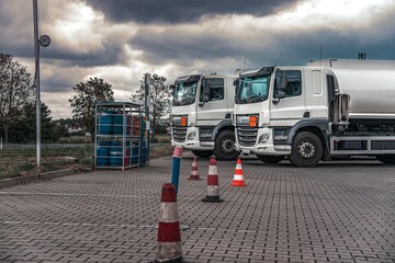 fuel truck at gas station, delivery of dangerous goods