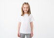 © Ievgen Skrypko - Smiling little girl posing in blank white t-shirt with copy space
