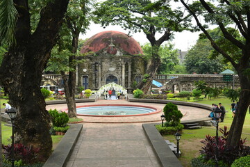 Saint Pancratius Chapel facade and water fountain at Paco park in Manila, Philippines