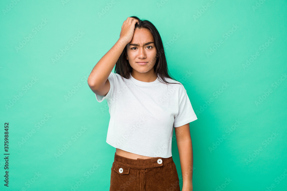 Young mixed race indian woman isolated tired and very sleepy keeping hand on head. - obrazy, fototapety, plakaty 
