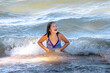 © Susan - Pretty young girl  splashes in a wild lake Michigan