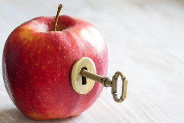 Wall Mural - Key and apple, key to health. Healthy eating concept 