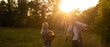 © Angelov - Happy family walking in field and looking at sunset