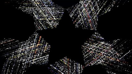 Wall Mural - black star silhouette. star shape revealed by a glittering background.