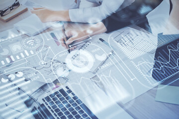 Fototapete - Technology theme hologram over woman's hands taking notes background. Concept of Tech. Double exposure