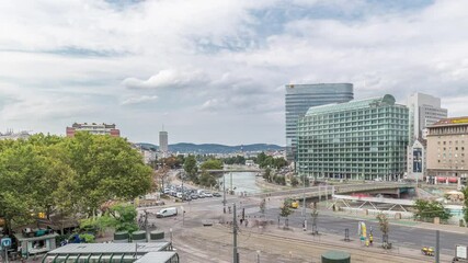 Wall Mural - The Schwedenplatz aerial timelapse (Sweden Square) is a square in central Vienna, located at the Danube Canal and one of the most important public transport junction. Old and modern buildings around