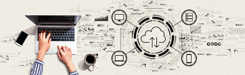 Wall Mural - Cloud computing with person using a laptop computer