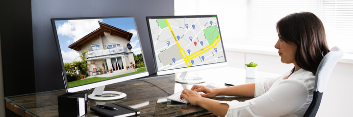 Wall Mural - Woman Searching For Real Estate Online