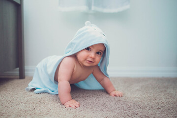 Wall Mural - Little boy baby playing ins room on a carpet by his crib 