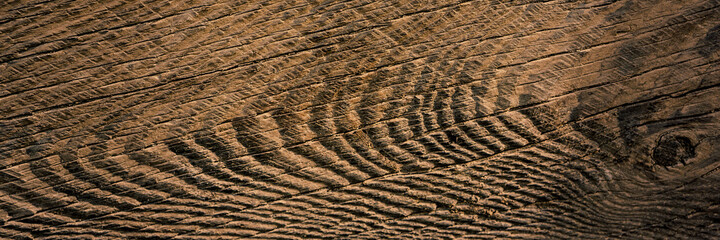 Sticker - surface of the old wooden board is covered with cracks and scratches.