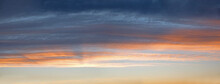 Sky Panorama With Gray And Orange Clouds, Above Blue Sky