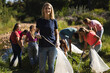 © Wavebreak Media - Volunteers cleaning up river in the countryside
