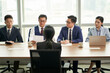© imtmphoto - female asian candidate being interviewed by a group of business people