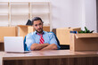 © Elnur - Young male employee in relocation concept